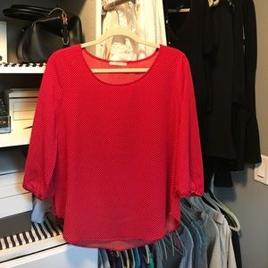 Textured red and white polka dot shirt